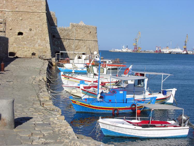 colourful fishing boats at the old harbour of heraklion